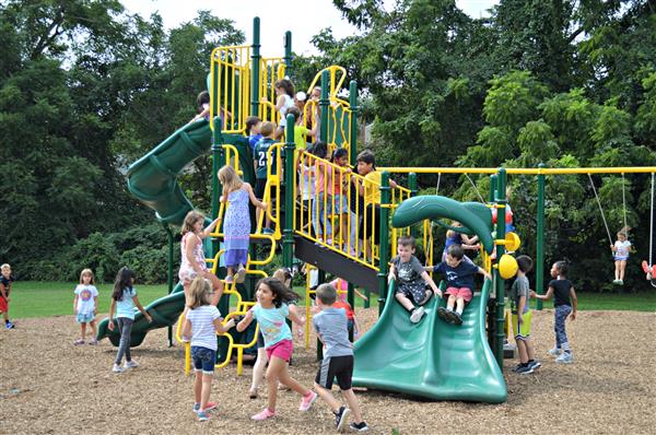 Students enjoy the new playground equipment at Glen Acres 